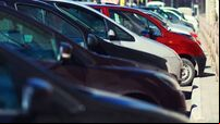 Lot of cars parking in the city, view side