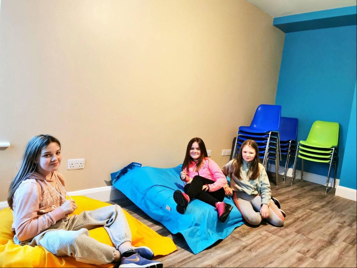 Young girls enjoying the bean bags at the new youth project centre. Young girls enjoying the bean bags at the new youth project centre.