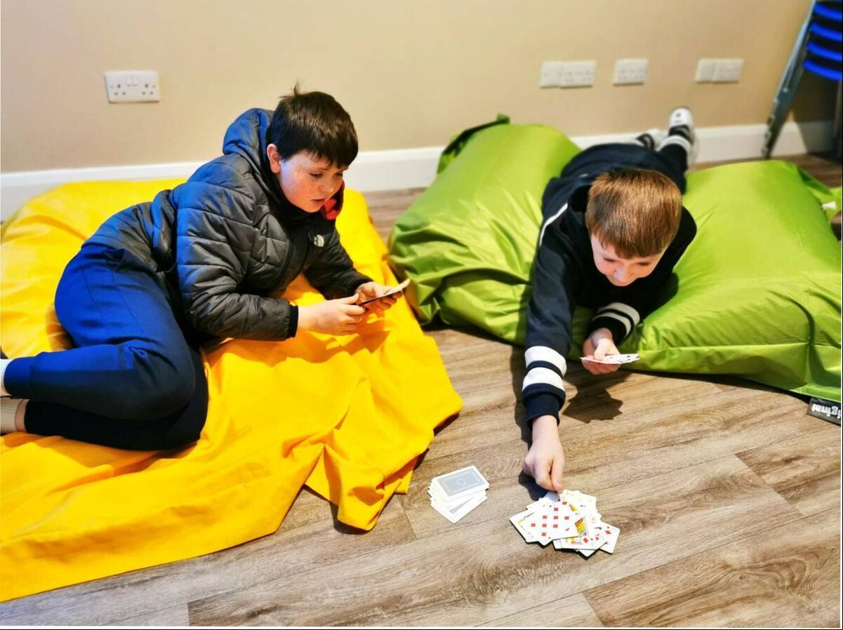Young people from the Togher area playing cards at The Pod Youth Resilience Project. Young people from the Togher area playing cards at The Pod Youth Resilience Project.