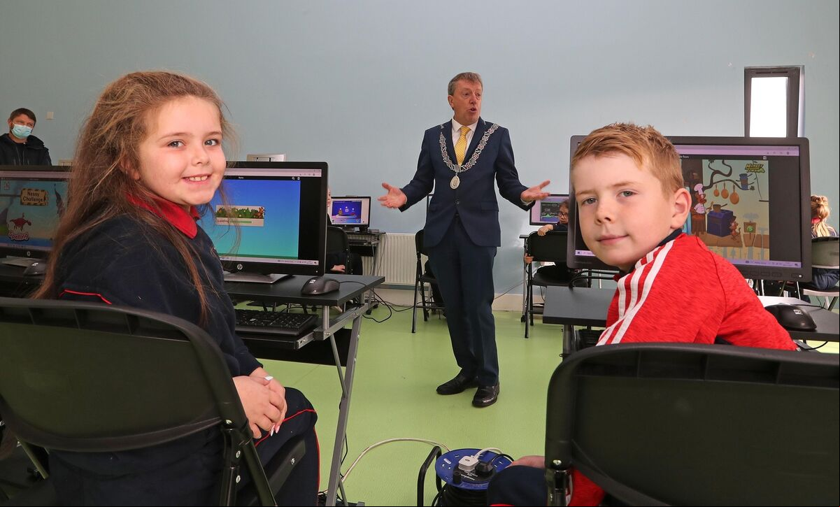 Lexi Heaphy and Darragh McCarthy, 3rd class listen to Cllr Tony Fitzgerald, Deputising for the Lord Mayor, speaking during the celebrations. Picture: Jim Coughlan. Lexi Heaphy and Darragh McCarthy, 3rd class listen to Cllr Tony Fitzgerald, Deputising for the Lord Mayor, speaking during the celebrations. Picture: Jim Coughlan.