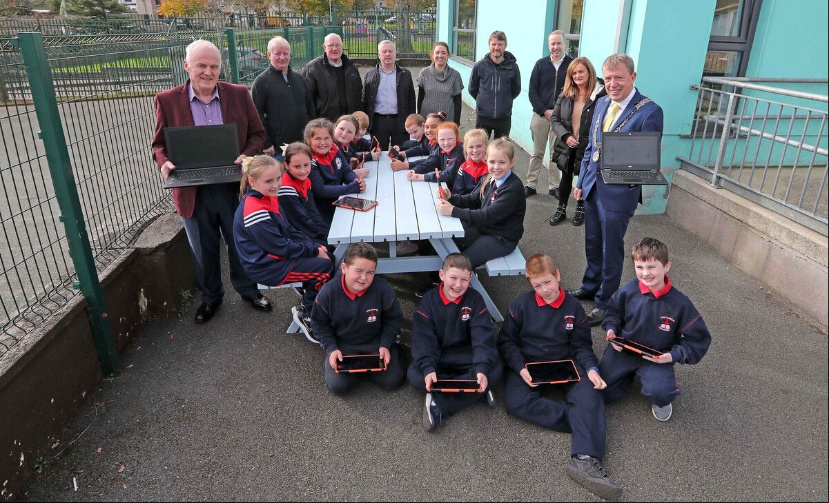 School childrenwith their new tablets with Denis O'Donovan, Frank Falvey, fundraisers, Fr. Tomas Waslh, PP, Sean Barry, teacher, Deputy Principal, Sinead Elliffe, Dan Devereux, HSCL, Principal, Ken Foley, Ursula Courtney, SNA and Cllr Tony Fitzgerald, Deputising for the Lord Mayor. Picture: Jim Coughlan. School childrenwith their new tablets with Denis O'Donovan, Frank Falvey, fundraisers, Fr. Tomas Waslh, PP, Sean Barry, teacher, Deputy Principal, Sinead Elliffe, Dan Devereux, HSCL, Principal, Ken Foley, Ursula Courtney, SNA and Cllr Tony Fitzgerald, Deputising for the Lord Mayor. Picture: Jim Coughlan.