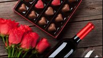 Valentines day with red roses, wine and chocolate