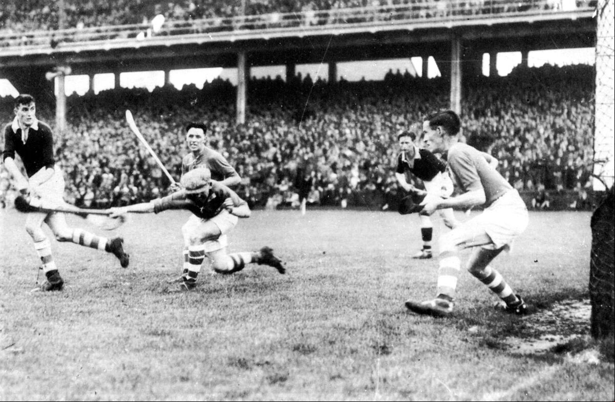 Joe Kelly of Cork scoring one of this two goals against Dublin in the 1944 All-Ireland hurling final, with captain Seán Condon in the background. Joe Kelly of Cork scoring one of this two goals against Dublin in the 1944 All-Ireland hurling final, with captain Seán Condon in the background.