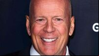 Bruce Willis cuddles puppy in first family photos since retirement due to health