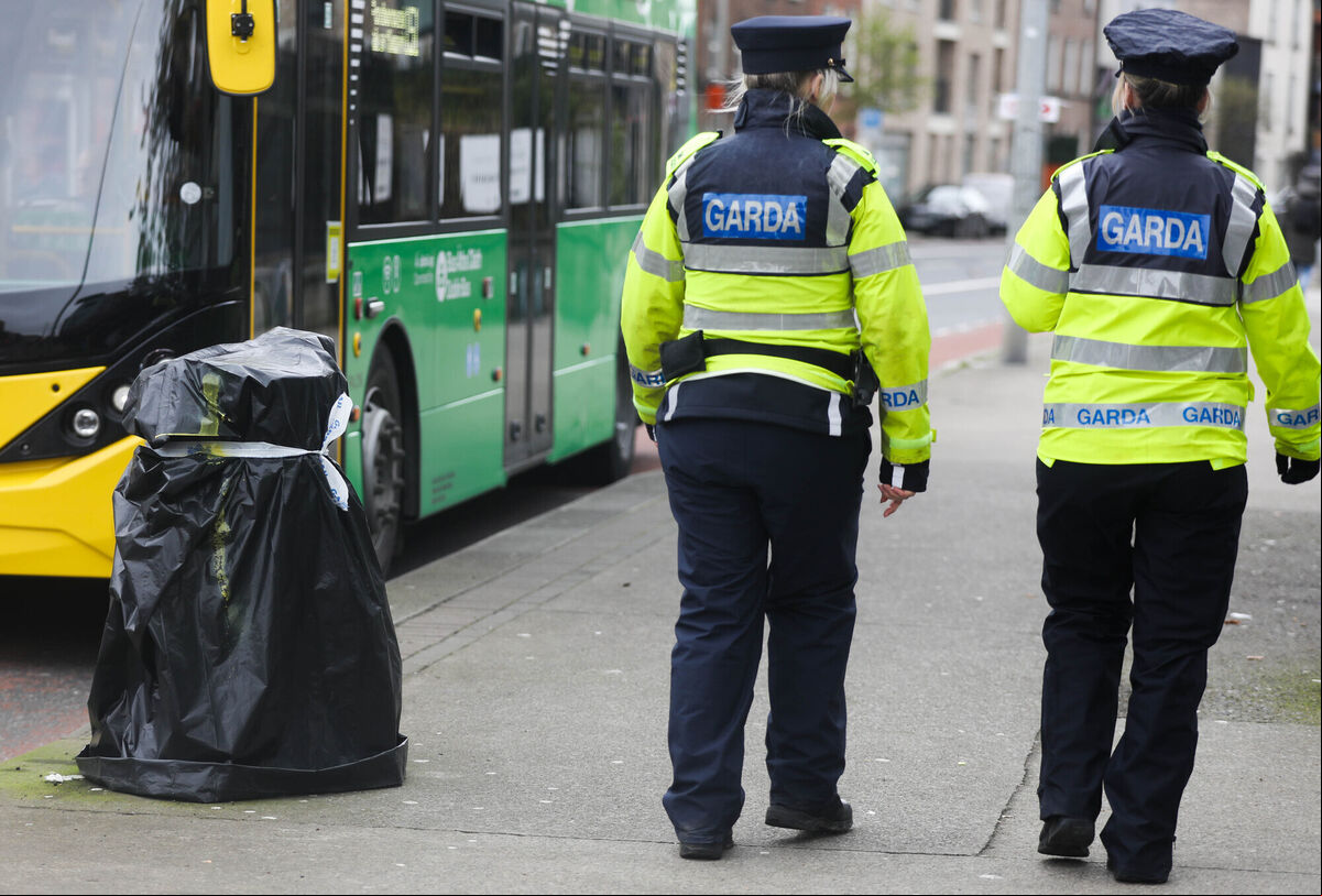 Pictured are Gardai ing a litter bin which has been taped closed as extra security precautions are put in place ahead of the visit of US President Joe Biden this week.. Photographer: Leah Farrell / RollingNews.ie Pictured are Gardai ing a litter bin which has been taped closed as extra security precautions are put in place ahead of the visit of US President Joe Biden this week.. Photographer: Leah Farrell / RollingNews.ie