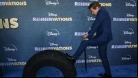 Jeremy Renner uses scooter and cane on first red carpet since snowplough injury