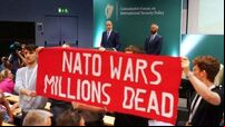 Gardaí remove protesters after Micheál Martin heckled at security policy forum