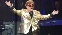 Elton John departs stage with hits-filled Glastonbury set
