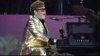 Who were Sir Elton John’s surprise musical guests at Glastonbury?