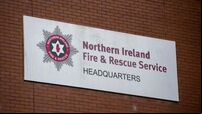 Three treated in hospital after arson attack at block of flats