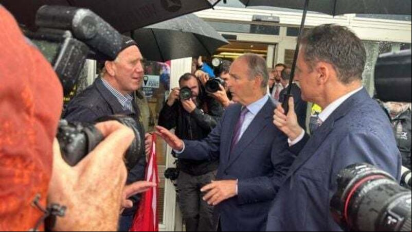 Tánaiste agrees to meet farmers protesting outside Fianna Fáil event Tánaiste agrees to meet farmers protesting outside Fianna Fáil event