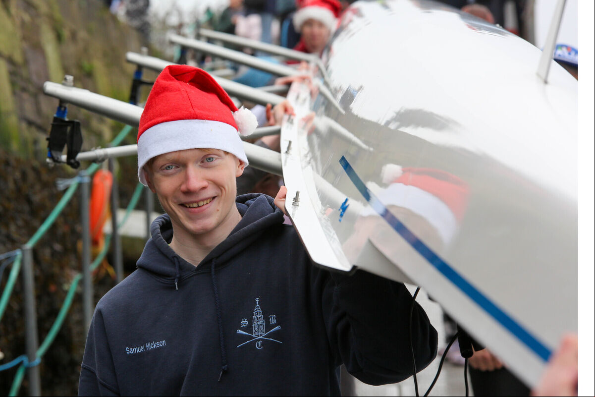 Stephens Day Scatter at the Marina, Cork: Samuel Hickson from Shandon Rowing Club shoulders his teams vessel for the Stephens Day Scatter which took place at the Marina. picture by Noel Sweeney