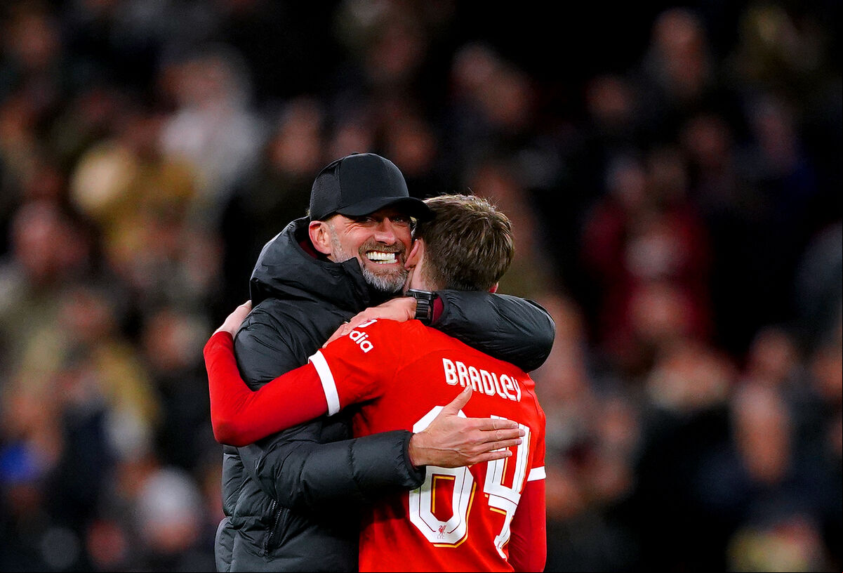 Liverpool manager Jurgen Klopp (left) hugs Conor Bradley at the end of the Carabao Cup semi final first leg match at Anfield, Liverpool. Picture: Peter Byrne/PA Wire. Liverpool manager Jurgen Klopp (left) hugs Conor Bradley at the end of the Carabao Cup semi final first leg match at Anfield, Liverpool. Picture: Peter Byrne/PA Wire.