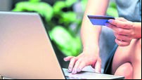 Stylish business woman paying with credit card. Online website identification in laptop. Electronic money transfer. Security fro