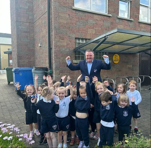 John Mullins with the young pupils in Bishopstown. John Mullins with the young pupils in Bishopstown.