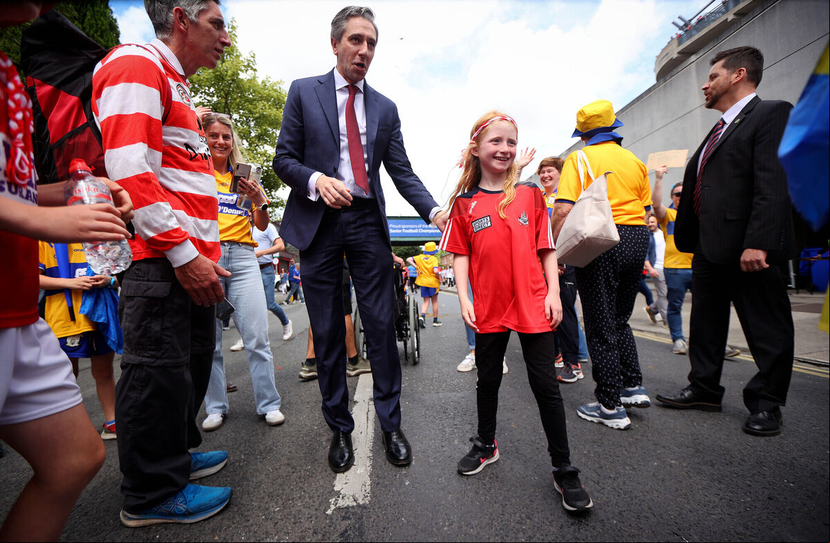 Taoiseach Simon Harris with fans outside Croke Park ahead of yesterday's game 