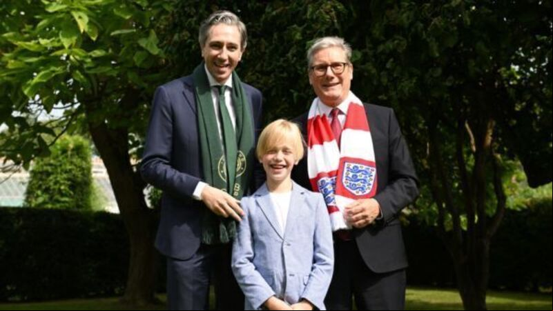 Dublin boy treated for rare illness presents Harris and Starmer with football shirts