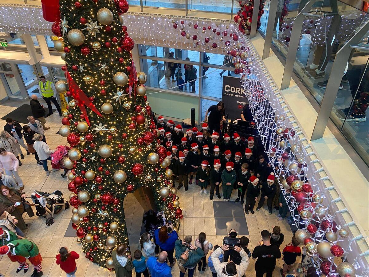 Pupils from Gaelscoil Mhachan carol singing in Mahon Point for the arrival of Santa. Pupils from Gaelscoil Mhachan carol singing in Mahon Point for the arrival of Santa.