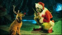 The Grinch Played By Jim Carrey Conspires With His Dog Max To Deprive The Who's Of Thei