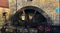 Water wheel starts turning again to power restaurant at historic mill