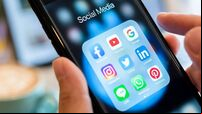 BANGKOK, THAILAND- 26 June 2019 : Hands of man use Iphone 7 plus with social media application of facebook, youtube, google sear