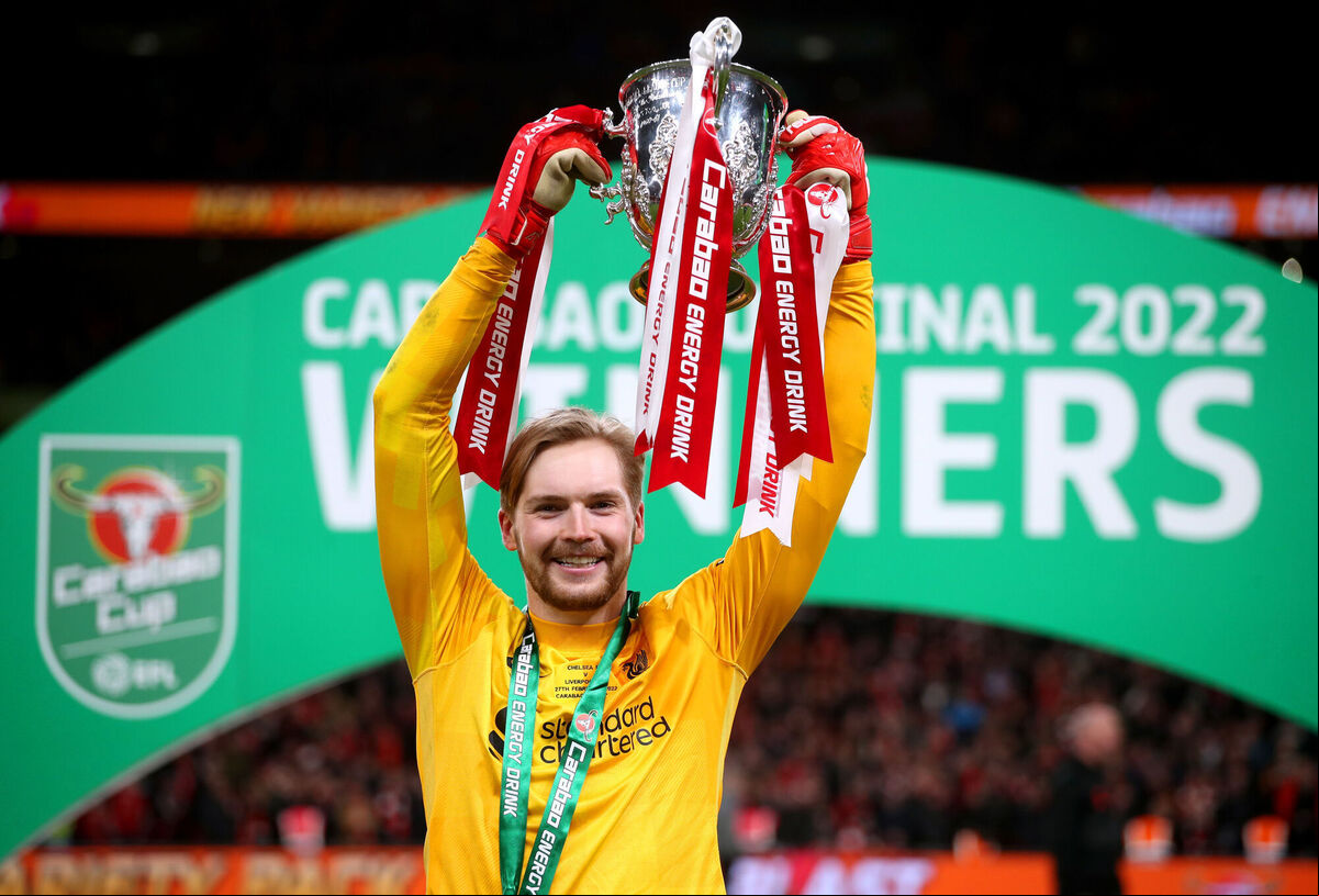 Liverpool's 2022 Carabao Cup final hero Caoimhin Kelleher lifts the trophy. Picture: Nick Potts/PA Wire Liverpool's 2022 Carabao Cup final hero Caoimhin Kelleher lifts the trophy. Picture: Nick Potts/PA Wire