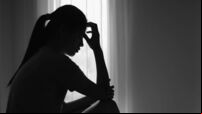 Young  women sitting in dark room feeling pain with life problem.  suffering from husband violence, Stop violence against and se