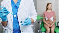 Cytobrush for sampling endocervical cells in doctor hands during PAP test on woman patient in gynecologist's office. PAP test, c