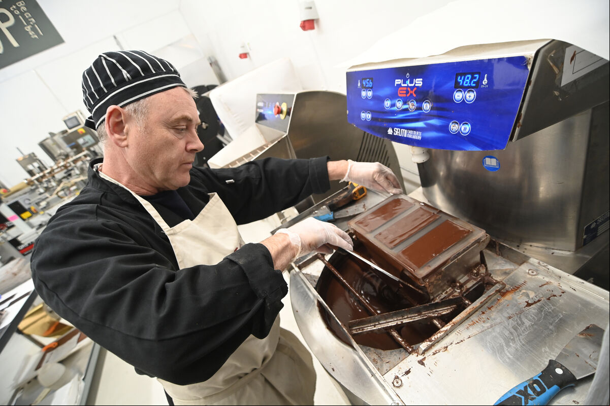 Paul O'Connell moulds the bars after tempering, which makes the chocolate shelf stable , gives the bars a nice snap when cracked, and produces a bright sheen. Picture: Larry Cummins Paul O'Connell moulds the bars after tempering, which makes the chocolate shelf stable , gives the bars a nice snap when cracked, and produces a bright sheen. Picture: Larry Cummins