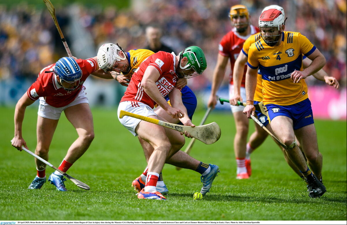 Brian Roche of Cork battles for possession against Adam Hogan of Clare in injury time. Picture: John Sheridan/Sportsfile Brian Roche of Cork battles for possession against Adam Hogan of Clare in injury time. Picture: John Sheridan/Sportsfile