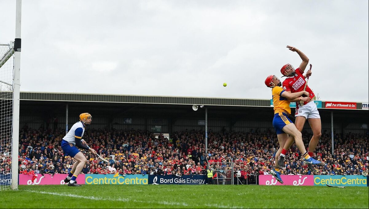 Brian Hayes of Cork attempts to palm the sliotar to the net as he is tackled by Darragh Lohan of Clare. Picture: Brendan Moran/Sportsfile Brian Hayes of Cork attempts to palm the sliotar to the net as he is tackled by Darragh Lohan of Clare. Picture: Brendan Moran/Sportsfile