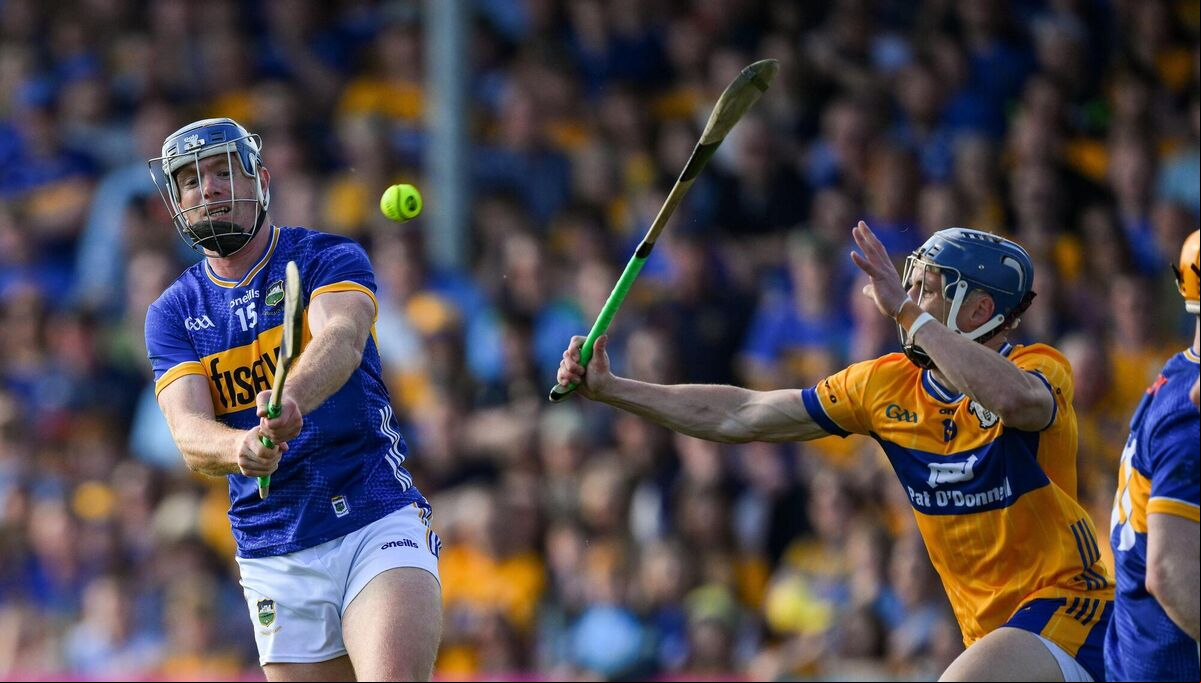Jason Forde of Tipperary scores a point under pressure from Rory Hayes. Photo by Ray McManus/Sportsfile Jason Forde of Tipperary scores a point under pressure from Rory Hayes. Photo by Ray McManus/Sportsfile