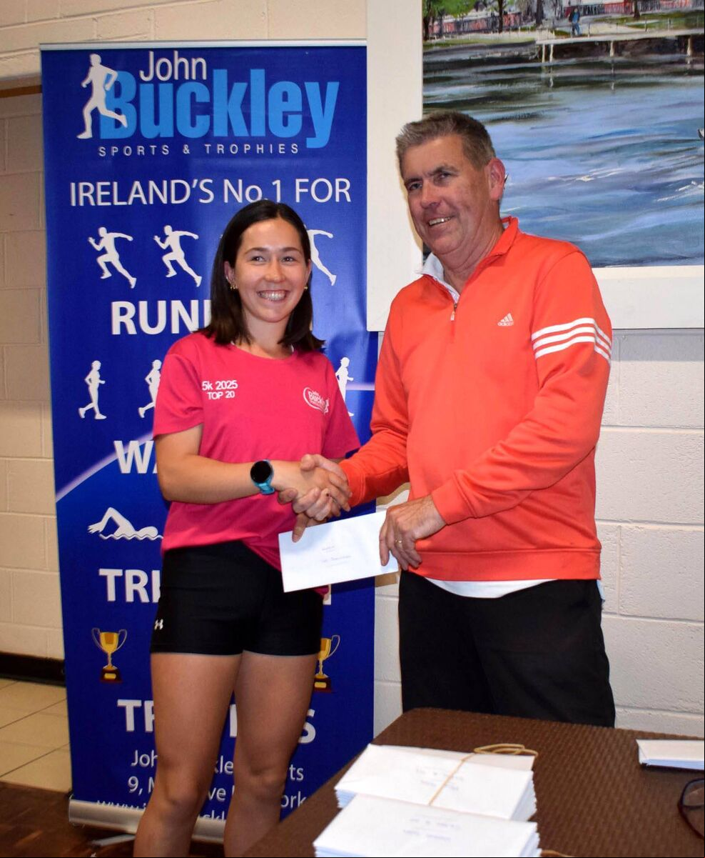 Holly Carroll, first in the women's race at the John Buckley Sports 5km, receiving her prize from Conor Kavanagh. Picture: John Walshe Holly Carroll, first in the women's race at the John Buckley Sports 5km, receiving her prize from Conor Kavanagh. Picture: John Walshe