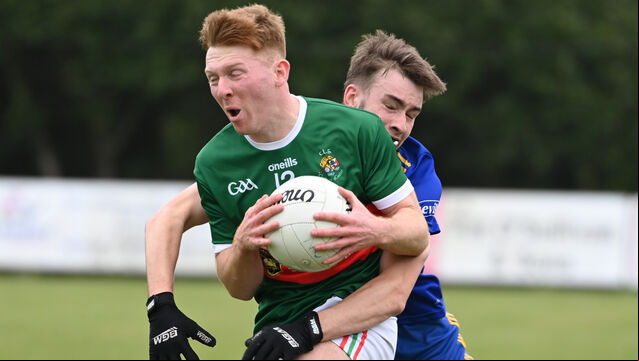 <p>Clonakilty's Ross Mannix is tackled by Carrgaline's Nathan O'Keeffe during the McCarthy Insurance Group FL Division 1 game on Sunday. Picture: Eddie O'Hare</p>